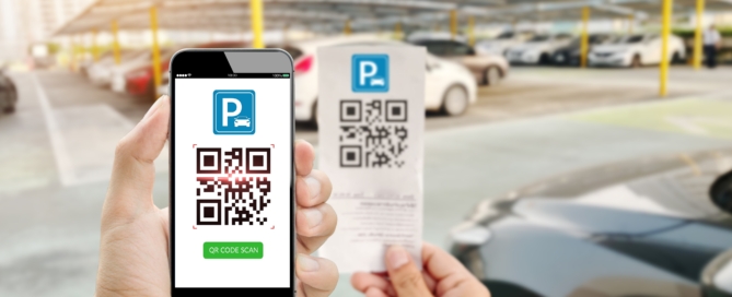 A phone scans a parking ticket QR Code.