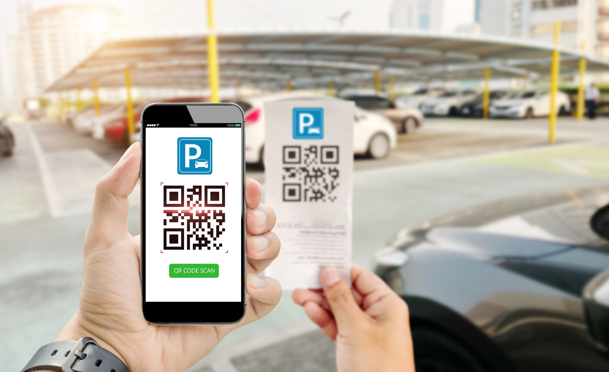 A phone scans a parking ticket QR Code.